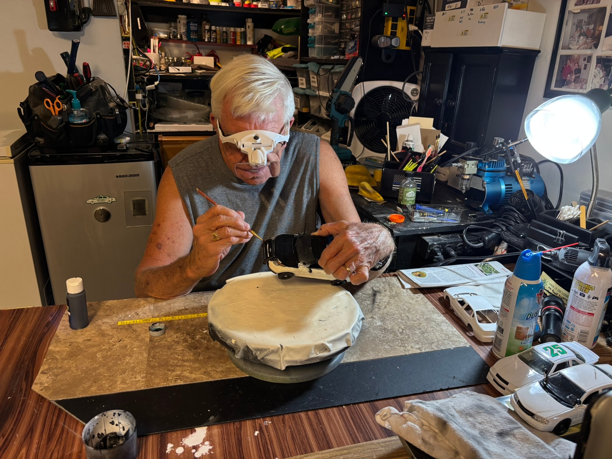 Tom Leary working on a die-cast model at his workbench